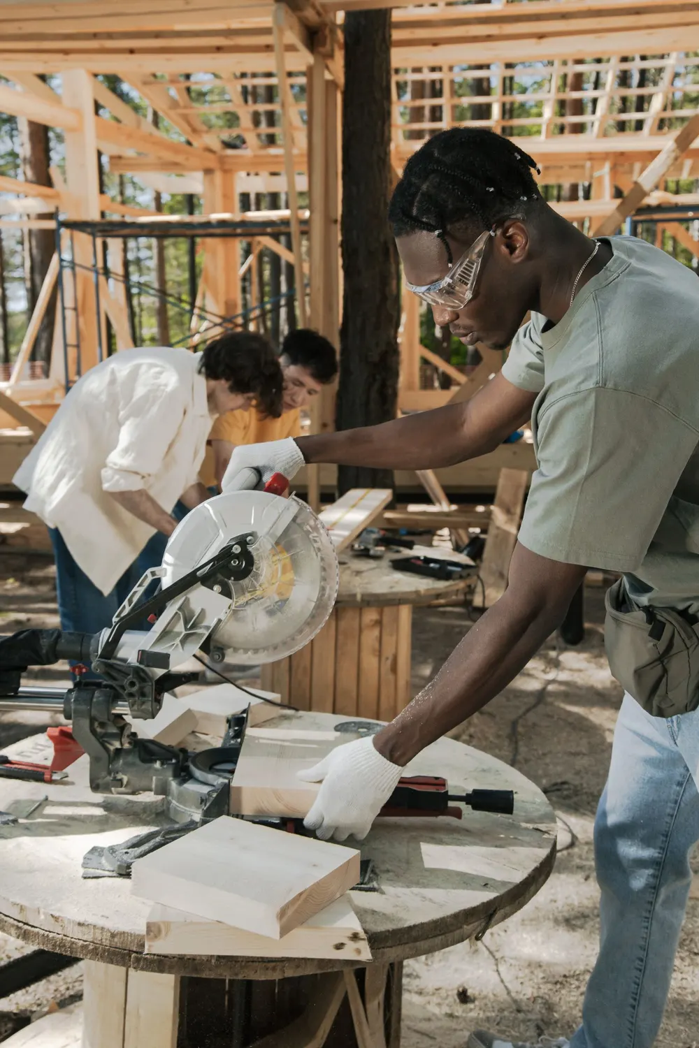 Crew cutting lumber on a framing job