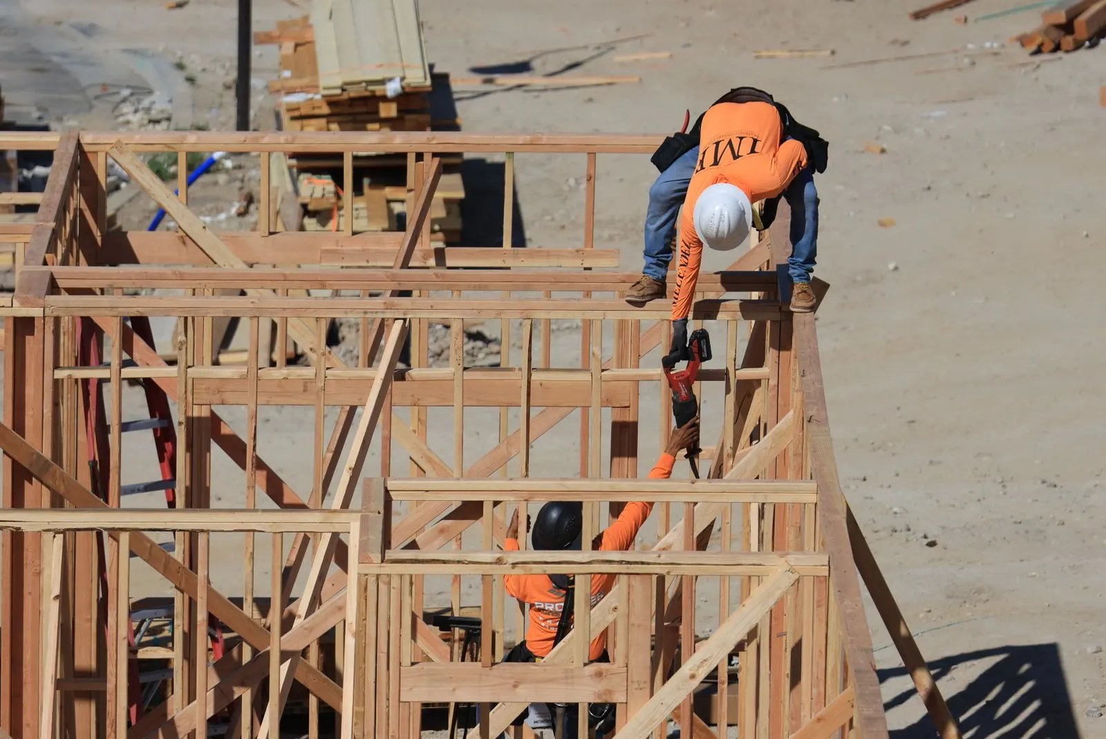 Framing crew building a new house addition